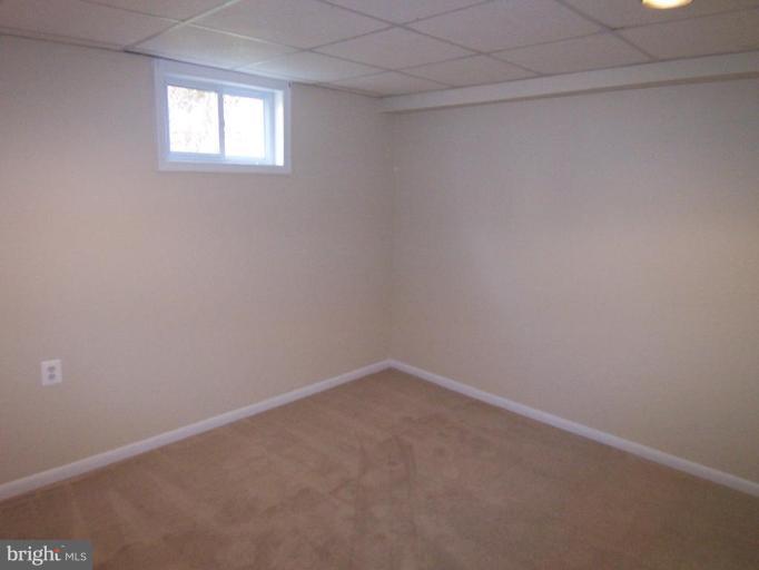 8110 Phelps Place District Heights, MD 20747 - Photo 10 of 13 an empty room with a window