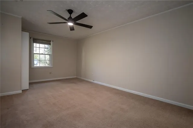 wooden floor in an empty room with a fireplace