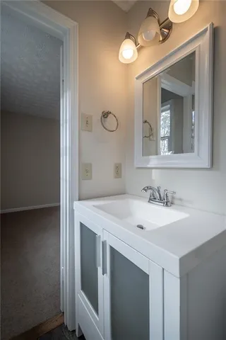 a wooden bench sitting in middle of a forest