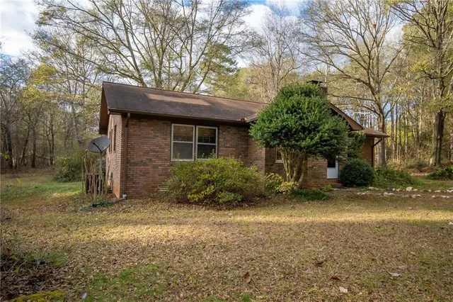 a backyard of a house with lots of green space