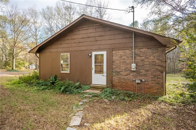 a kitchen with granite countertop stainless steel appliances a refrigerator sink and microwave