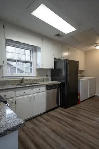 a view of a yard with trees in the background