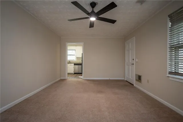 a view of a house with a yard and tree