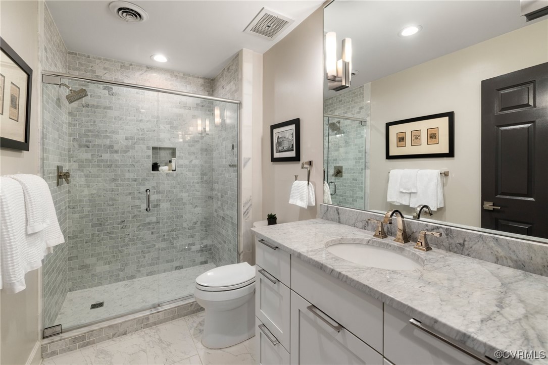 413 Stuart Circle, Unit PLG Richmond, VA 23220 - Photo 19 of 30 Guest bathroom, oversize shower stall, carerra mar