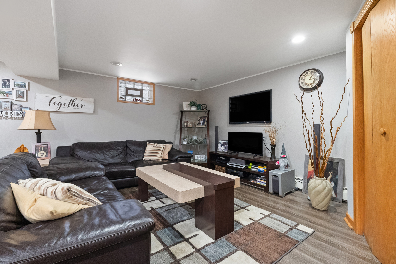 8232 Ferdinand Avenue Bridgeview, IL 60455 - Photo 15 of 35 a living room with furniture and a flat screen tv