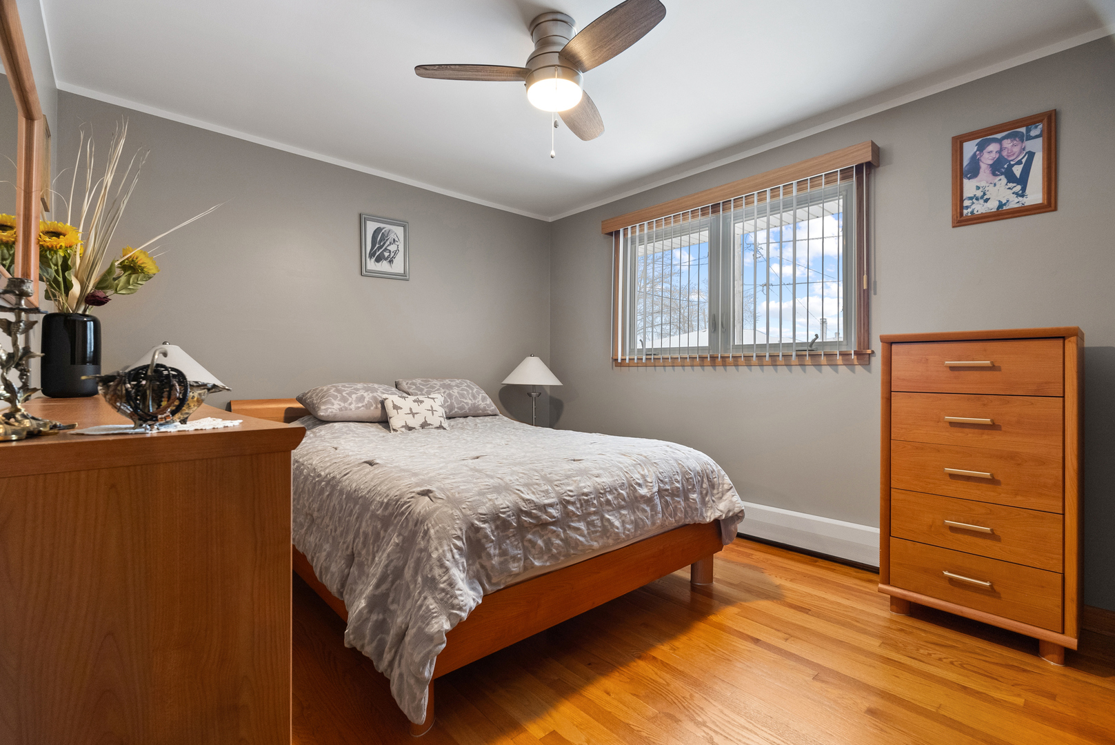 8232 Ferdinand Avenue Bridgeview, IL 60455 - Photo 18 of 35 a bed sitting in a bedroom next to a window and a dresser