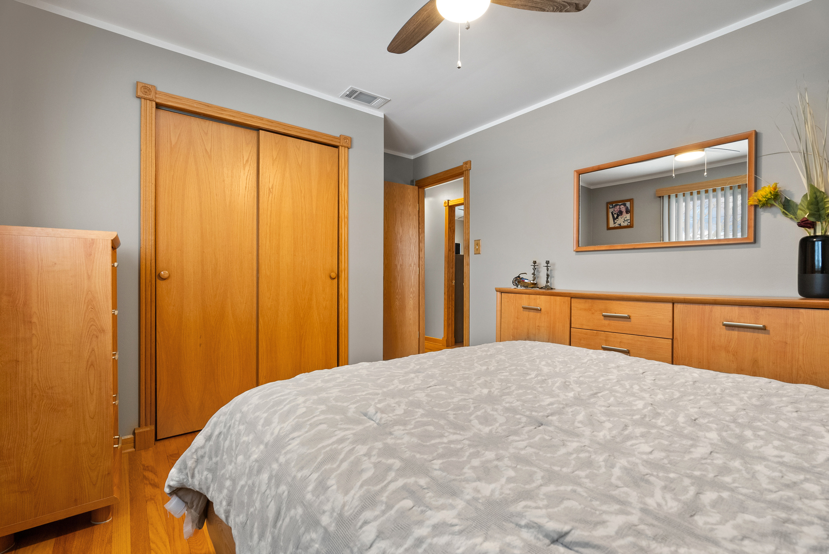 8232 Ferdinand Avenue Bridgeview, IL 60455 - Photo 19 of 35 a bedroom with a bed and a dresser