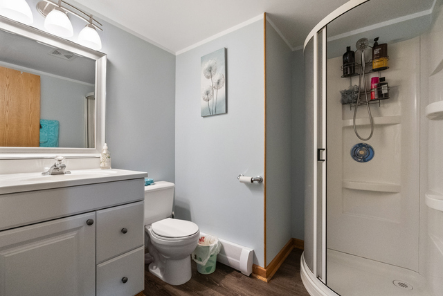 8232 Ferdinand Avenue Bridgeview, IL 60455 - Photo 32 of 35 a bathroom with a toilet sink and shower