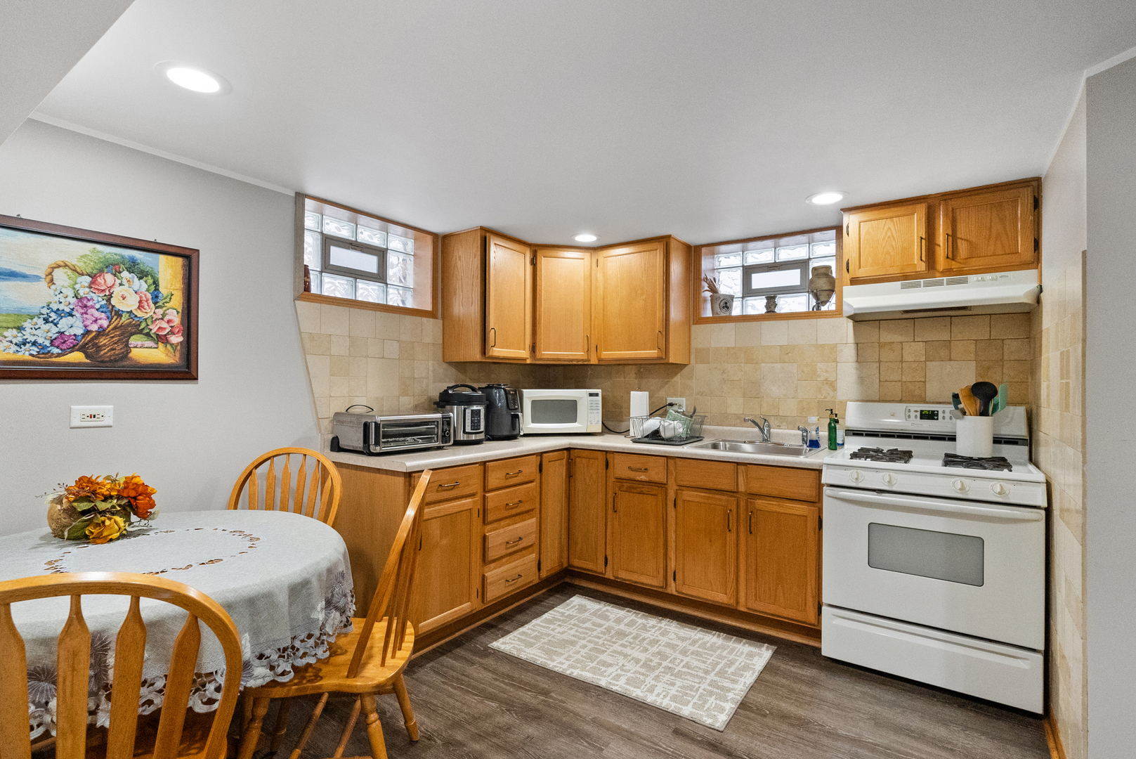 8232 Ferdinand Avenue Bridgeview, IL 60455 - Photo 33 of 35 a kitchen with stainless steel appliances granite countertop a stove a sink and a refrigerator