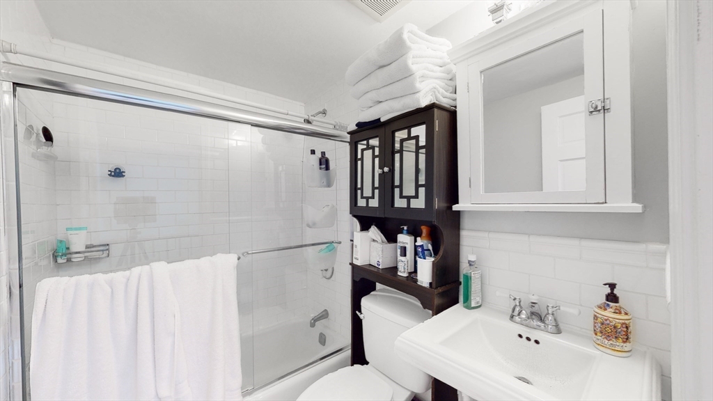 143 West Canton Street, Unit 4 Boston, MA 02118 - Photo 11 of 15 a bathroom with a sink toilet and shower