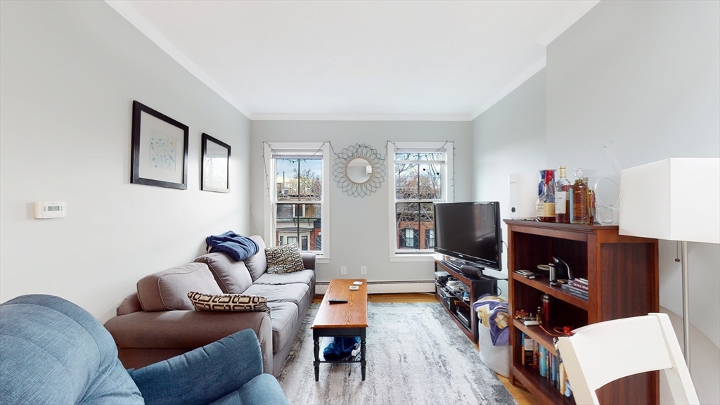 143 West Canton Street, Unit 4 Boston, MA 02118 - Photo 2 of 15 a living room with furniture and a flat screen tv