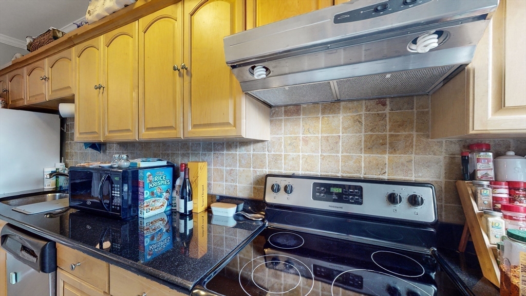 143 West Canton Street, Unit 4 Boston, MA 02118 - Photo 7 of 15 a kitchen with a stove and cabinets