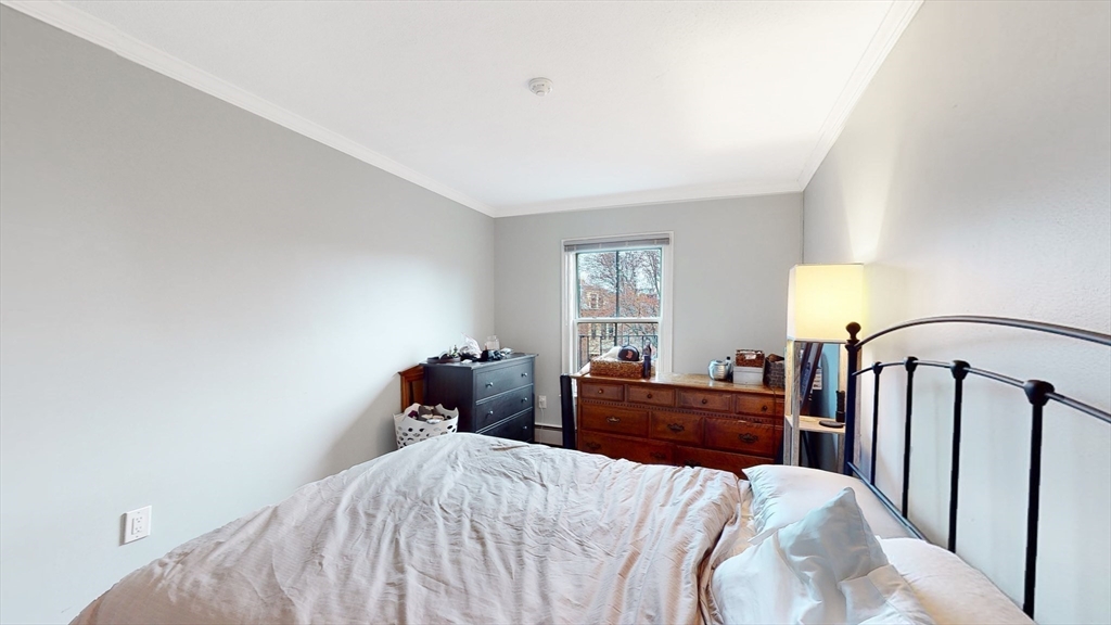 143 West Canton Street, Unit 4 Boston, MA 02118 - Photo 9 of 15 a bedroom with a bed and window