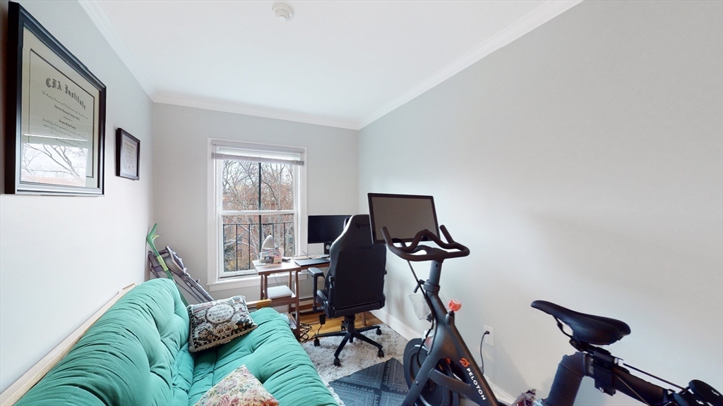 143 West Canton Street, Unit 4 Boston, MA 02118 - Photo 10 of 15 a living room with furniture a flat screen tv and a window