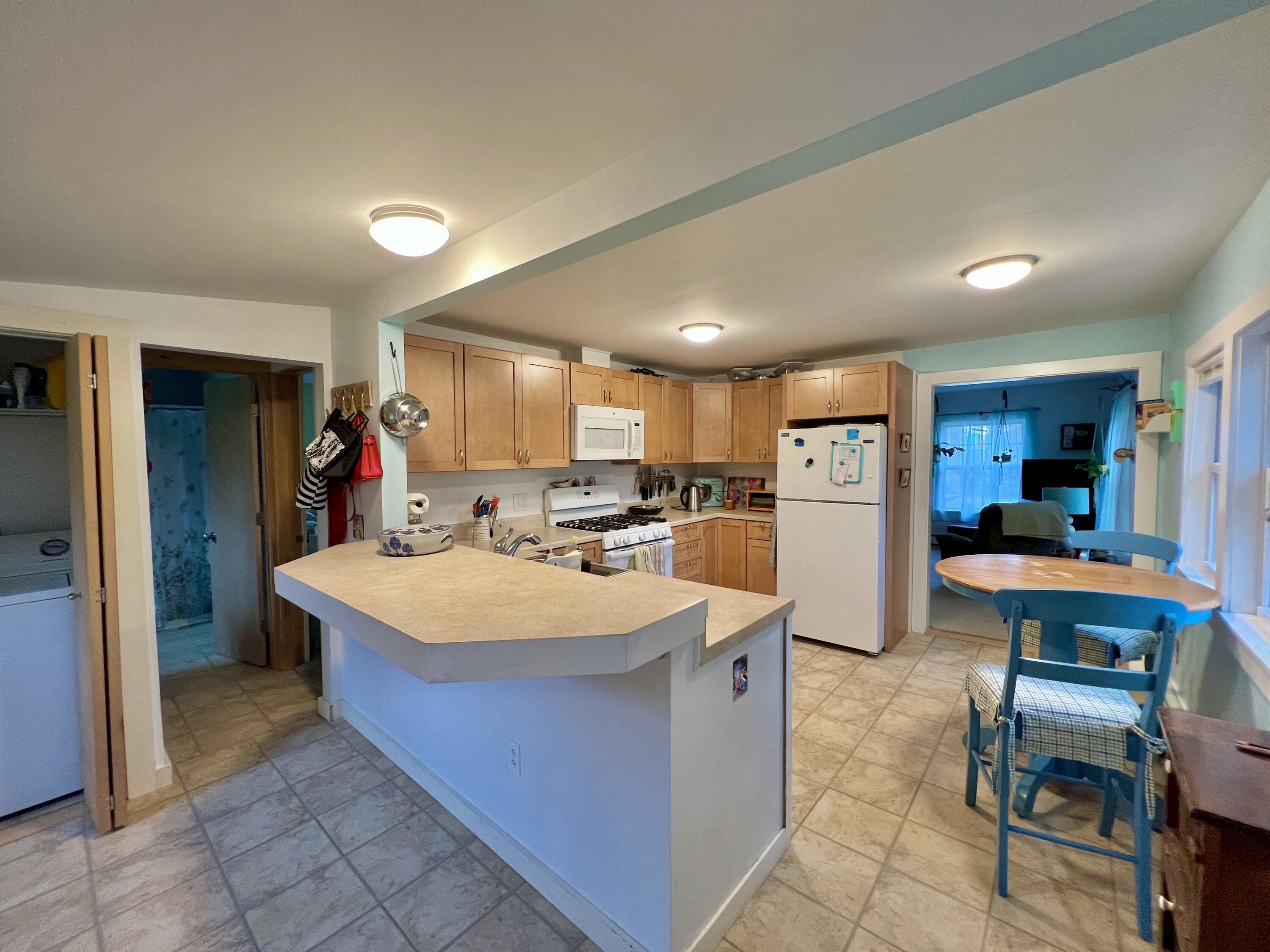 735 Oak Point Road Trenton, ME 04605 - Photo 4 of 30 View to Kitchen and Peninsula Bar