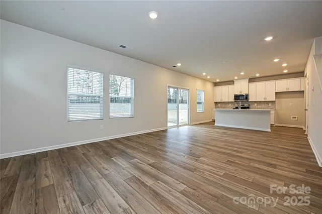 a view of a kitchen with a sink and a stove top oven