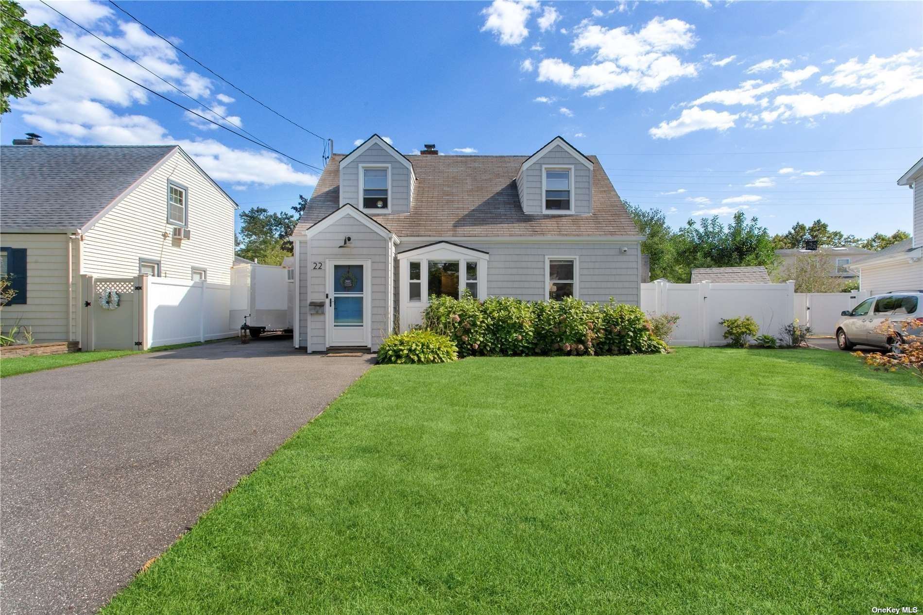 22 Wilson Road Valley Stream, NY 11581 - Photo 1 of 1 a front view of a house with garden