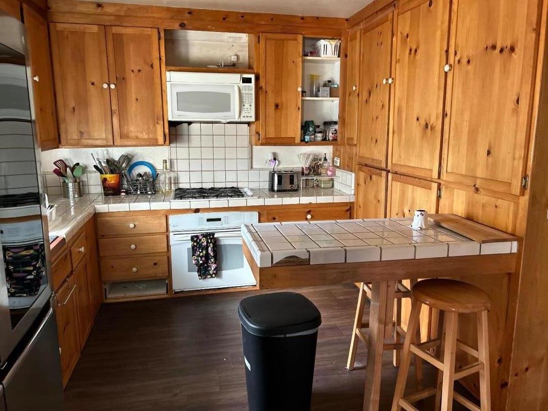 0 Undisclosed Address Gilroy, CA 95020 - Photo 10 of 18 a kitchen with a table chairs sink and cabinets