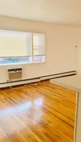 a view of an empty room with a window