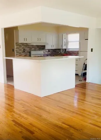 a view of kitchen with wooden floor