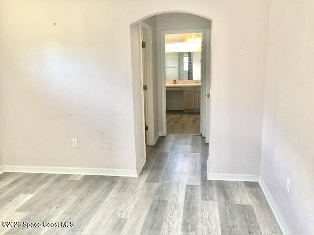 2033 Gloria Circle Palm Bay, FL 32905 - Photo 12 of 28 a view of a hallway with wooden floor