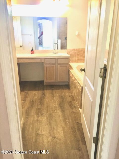 2033 Gloria Circle Palm Bay, FL 32905 - Photo 15 of 28 a bathroom with a tub sink and mirror