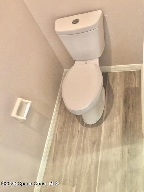 2033 Gloria Circle Palm Bay, FL 32905 - Photo 17 of 28 a bathroom with a toilet and a mirror