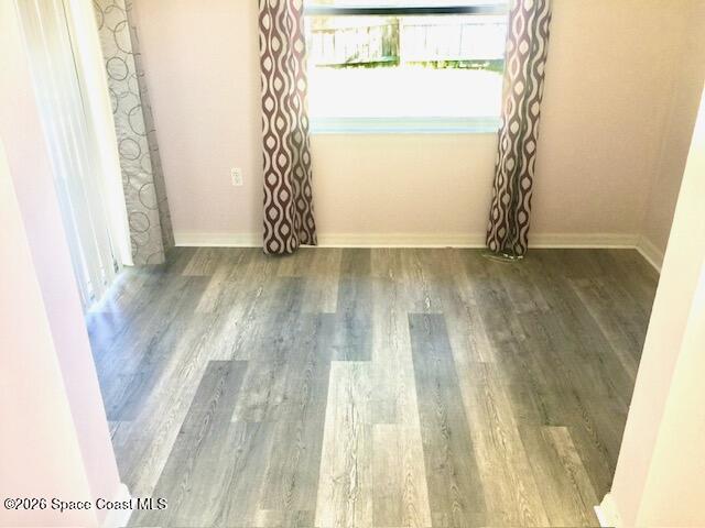 2033 Gloria Circle Palm Bay, FL 32905 - Photo 20 of 28 a view of a room with wooden floor and windows