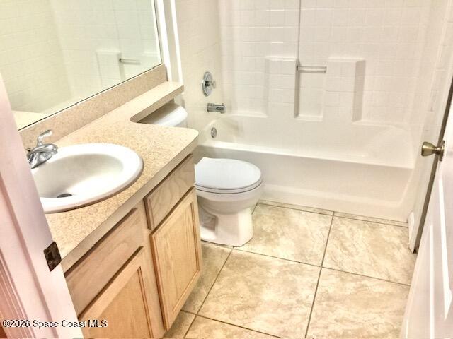 2033 Gloria Circle Palm Bay, FL 32905 - Photo 22 of 28 a bathroom with a sink a toilet and a mirror