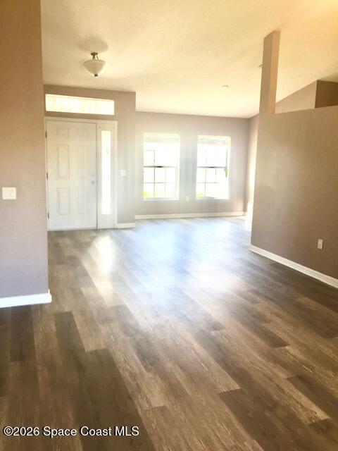 2033 Gloria Circle Palm Bay, FL 32905 - Photo 4 of 28 a view of an empty room with window and wooden floor