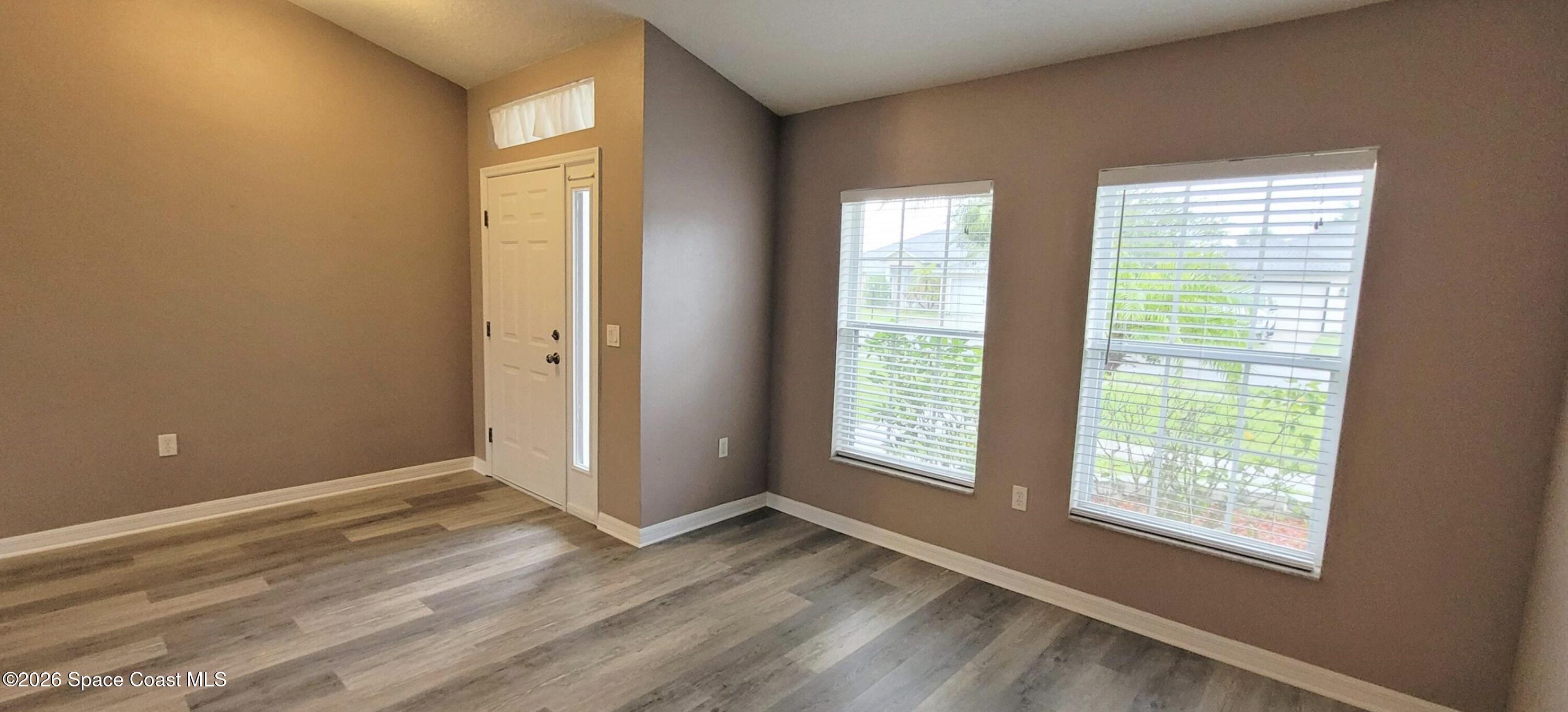2033 Gloria Circle Palm Bay, FL 32905 - Photo 6 of 28 a view of an empty room with a window