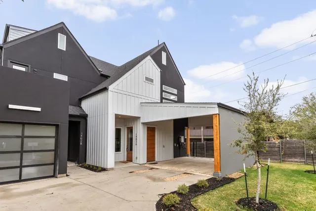 a front view of a house with a garage