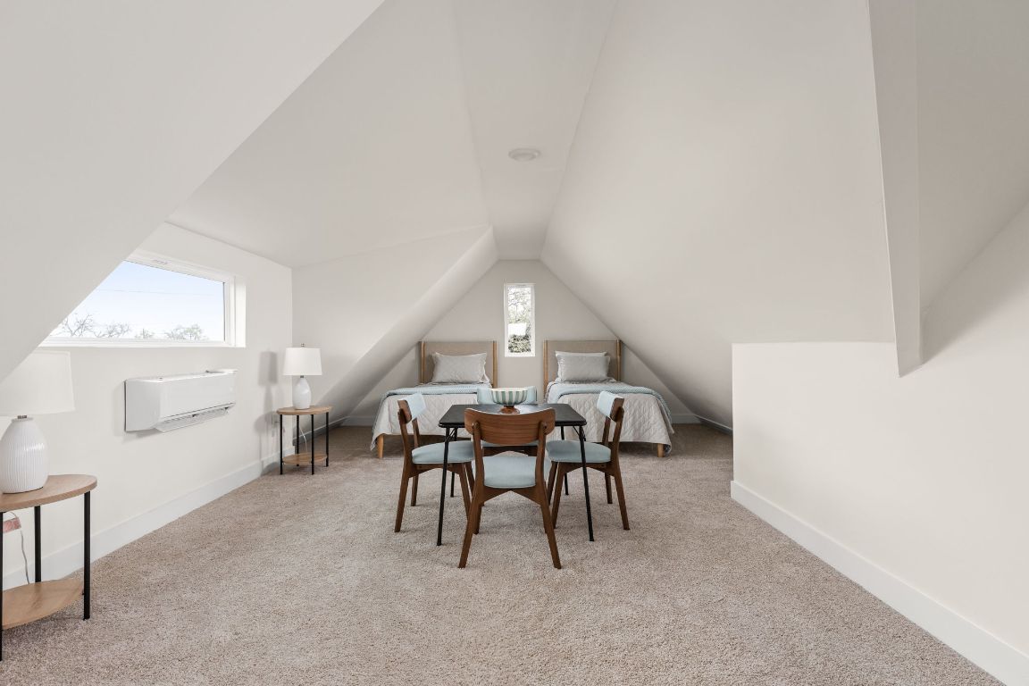 1402 Summit Street, Unit A Austin, TX 78741 - Photo 20 of 30 a dining room with furniture and window