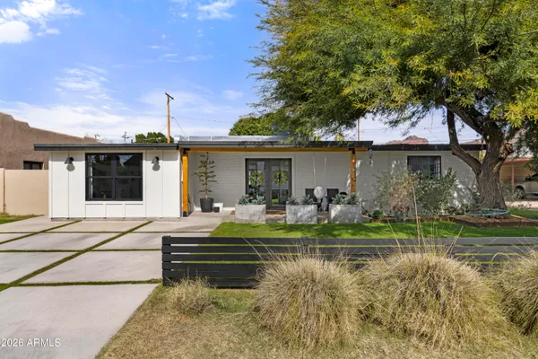 a front view of a house with garden