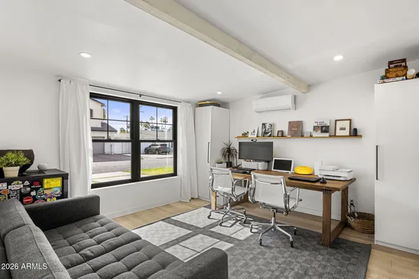 a work room with furniture and a window