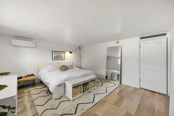 a bedroom with a bed and a table