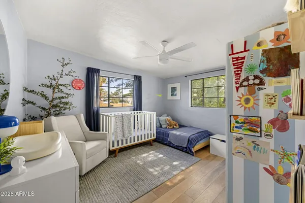 a bedroom with furniture and a window