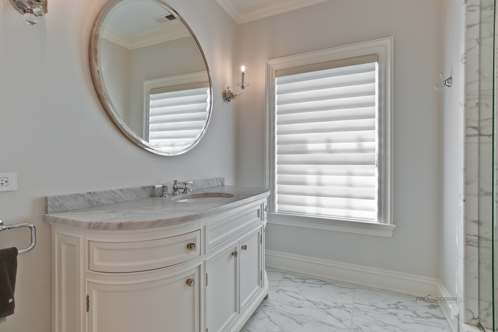 500 South Ridge Road Lake Forest, IL 60045 - Photo 36 of 54 a bathroom with a sink a mirror a vanity and a window