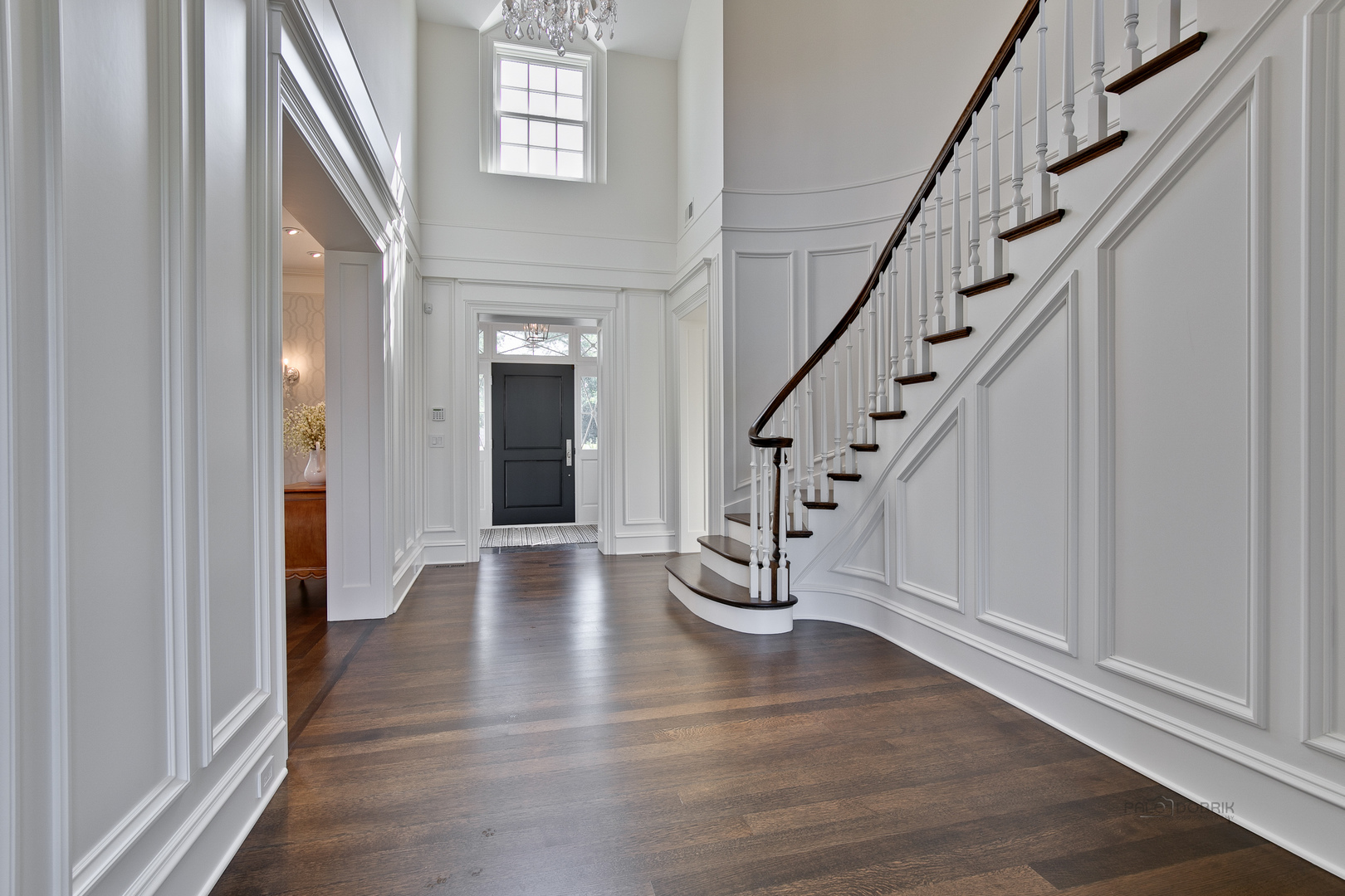 500 South Ridge Road Lake Forest, IL 60045 - Photo 5 of 54 a view of an entryway with wooden floor and stairs