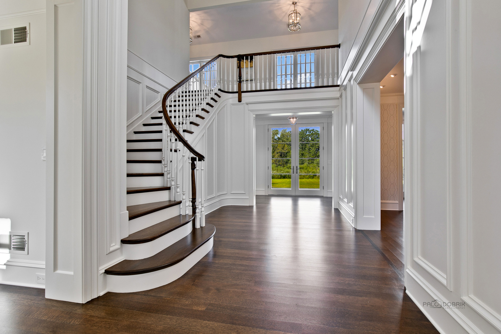 500 South Ridge Road Lake Forest, IL 60045 - Photo 6 of 54 a view of an entryway with wooden floor and stairs