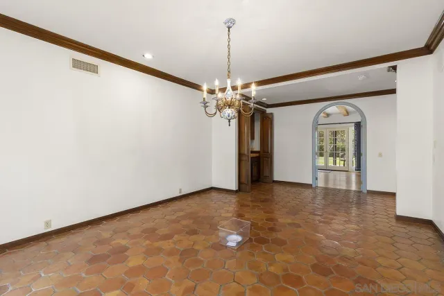 a kitchen with a refrigerator a sink and cabinets