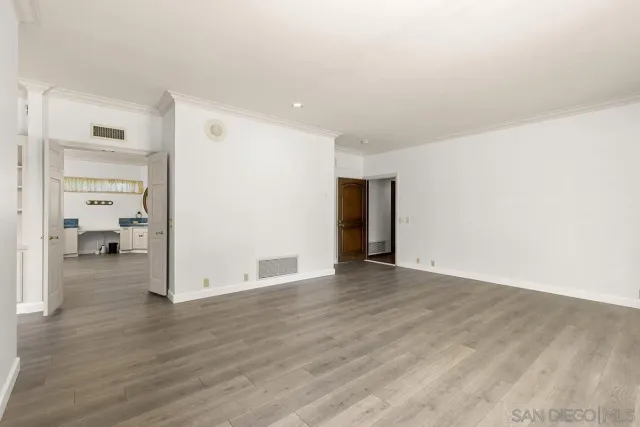a bathroom with a granite countertop sink mirror and a bathtub