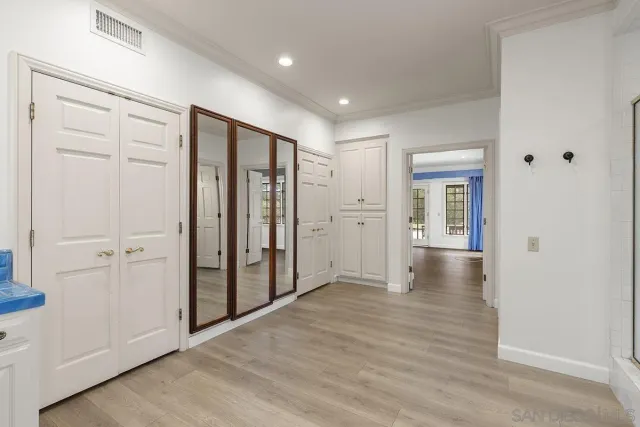 a view of a balcony with a yard