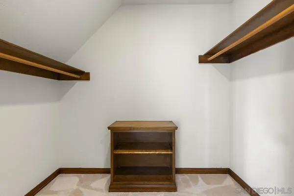 a view of a house with backyard porch and sitting area