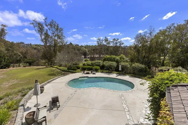 a front view of a house with wooden fence
