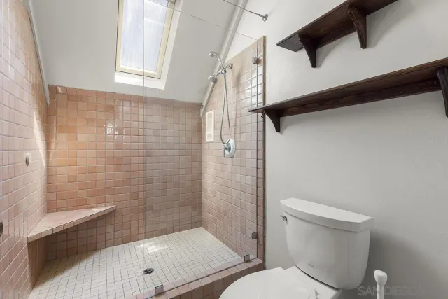 an aerial view of a house with a lake view