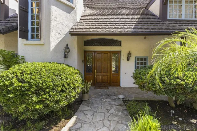 a view of entryway and hall with a front door