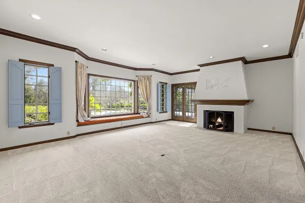 a view of a kitchen with a sink and a refrigerator