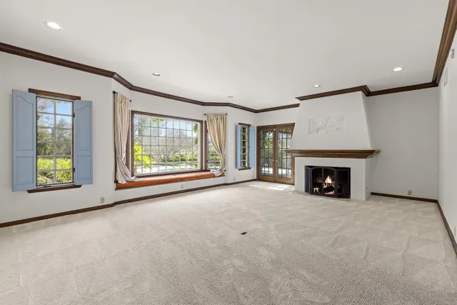a view of a kitchen with a sink and a refrigerator