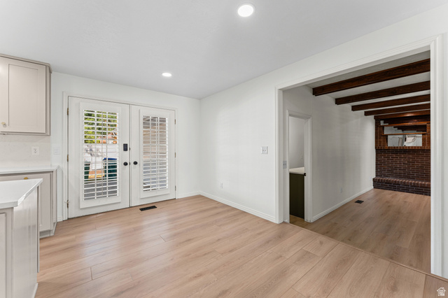 8441 Rua Branco Drive Sandy, UT 84093 - Photo 14 of 47 Bright room featuring a light wood-finish flooring, recessed lighting, and white walls